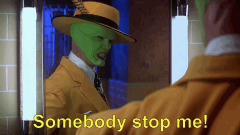 Jim Carrey as The Mask saying ‘somebody stop me!’ to himself in the bathroom mirror
